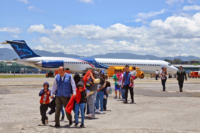 Photo credit: Foreign Ministry of Guatemala  Caption: Children deplane a Justice Prisoner and Alien Transportation System (JPATS) flight at the Guatemalan Air Force Base. From January to June of 2014, an estimated 1500 unaccompanied children have been deported from the United States to Central America. Site: http://www.speroforum.com/a/LPMGKNPJRX59/75048-Guatemala-receives-second-group-of-children-deported-by-US#.VBJk1vldX0Q